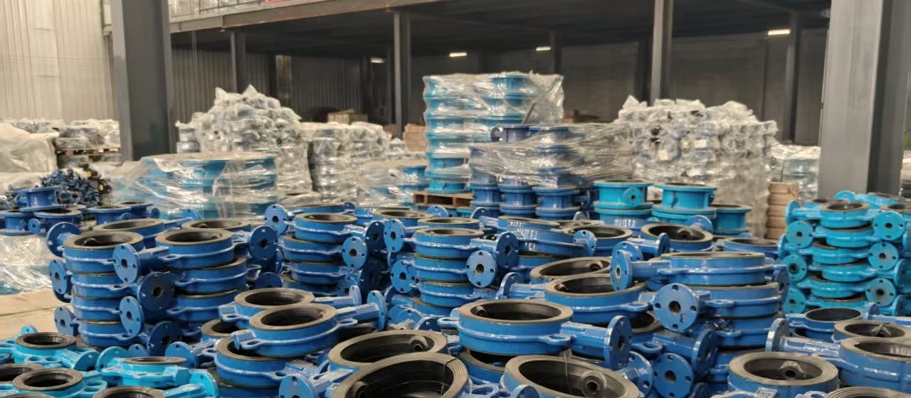 Flanged butterfly valves laid out on the factory floor
